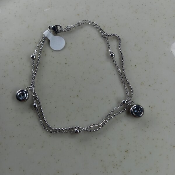 Pulsera Alice doble, con bolitas cubic redondo tornasol.