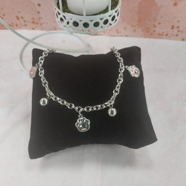 Pulsera con Bolitas + Dije Huellas Inflado