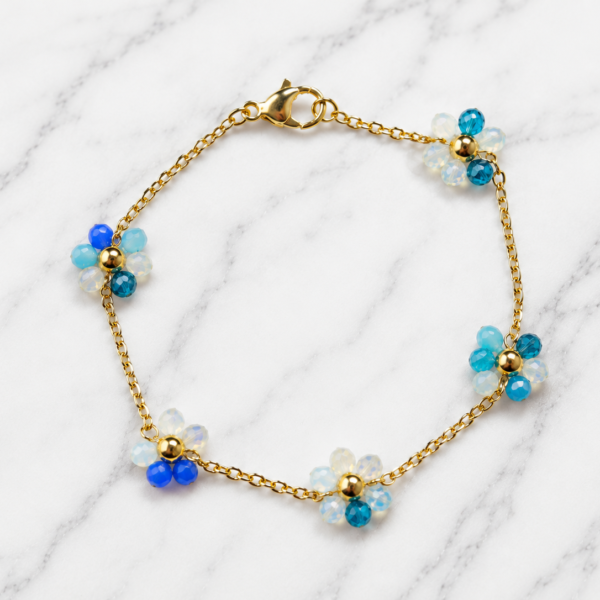 Pulsera Dorado Florcita - tonos celeste/azul